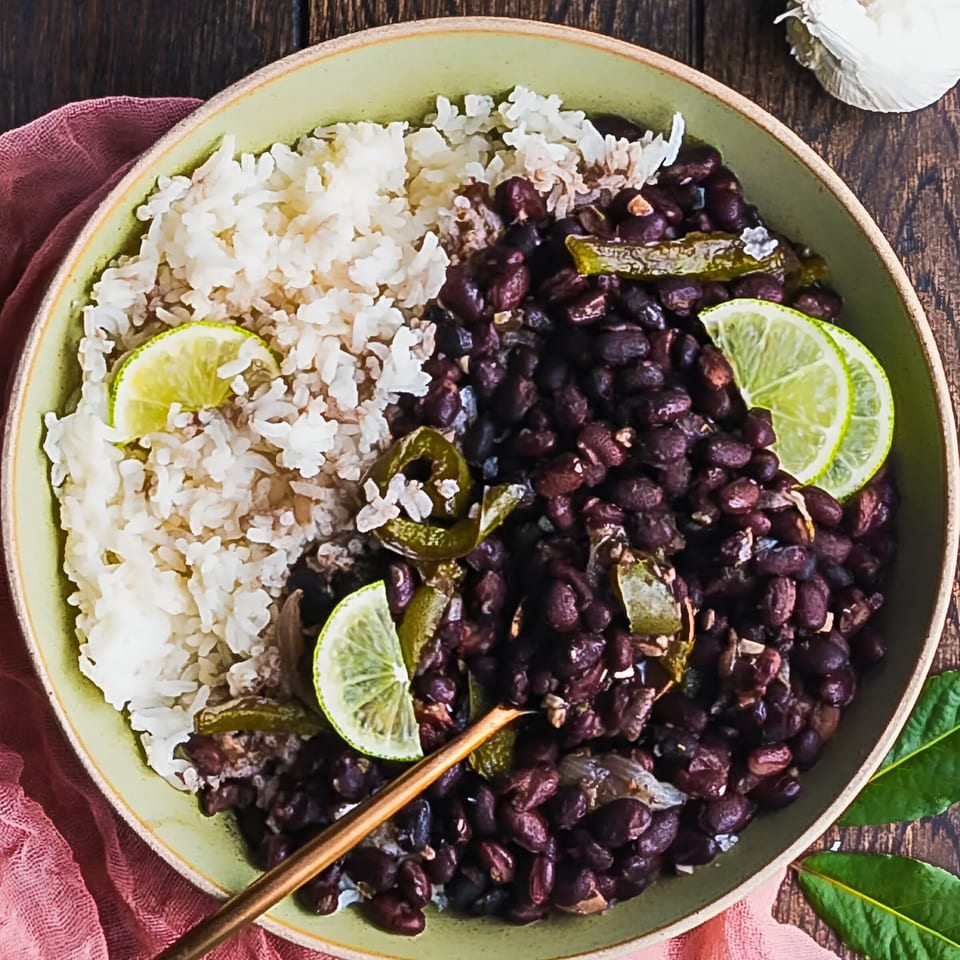 El Jefe's Grill Mexican BBQ black beans and rice with lime slices and green chilies.
